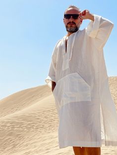 Hand made From start to finish Linen and cotton mixed lightweight fabric night gown for men Mens natural fabric caftan It's a special kind of linen which is only made in Anatolia ( i uploaded the fabric's detailed picture ) Lightweight White color Plus size avalible Small/medium/large/ xlarge / 2XL / 3XL / 4XL / 5XL size options Feel free to Ask for custom made Front pocket - kangaroo pocket Gift for him Super comfortable men's clothing to wear at home or outdoor Linen outfit Nightgown Pool part Casual White Long Sleeve Kaftan, Casual Summer Tunic Thobe, Casual Long Thobe For Vacation, Elegant Relaxed Fit Kaftan For Summer, Casual Tunic Thobe For The Beach, Elegant Summer Kaftan With Relaxed Fit, Casual White Long Sleeve Thobe, Casual Summer Vacation Thobe, Elegant White Thobe For Beach