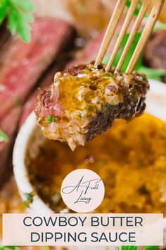 a close up of a fork with food on it and the words cowboy butter dipping sauce