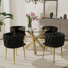 a glass table with four chairs around it in a living room next to a potted plant