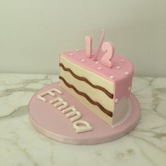 a pink and white cake with the number two on it