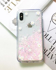 an iphone case with pink and white flowers on it