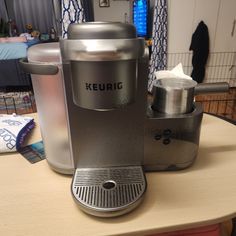 a keurig coffee maker sitting on top of a table