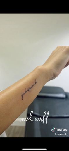 a person with a small tattoo on their arm