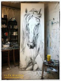 a drawing of a horse is on the wall