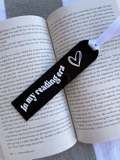 an open book with a black and white tag on it