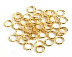 gold filled jump rings on white background