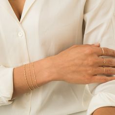 Get our sweetest, subtlest bracelets with the Dainty Bracelet Chain Set. When it comes to adding a touch of glam to your day, any of these three chains will be your go-to! Choose one to pair with your yoga pants in the morning or with your favorite jeans for a girl's day out. You can also layer them together for a gorgeous stack. DETAILS Set includes three bracelets: Dainty Chain Bracelet Dainty Satellite Chain Bracelet Pearl Chain Bracelet 14k gold filled -or- sterling silver chain, spring clas Rope Anklet, Bracelets Dainty, Girl Walk, Dainty Gold Bracelet, Love Knot Ring, Solid Gold Bracelet, Bracelet Pearl, Diamond Jewelry Necklace, Solid Gold Necklace