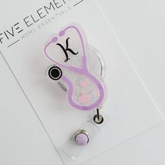 "Our badge reels are a cute gift idea for any special occasion. We carry a variety of themes to suit every profession, check our store to see our collections. All our badges are hand made using top quality FDA approve resin for that perfect glass looking finish. Each badge reel measures 2\" unless otherwise specify All badges reel will come with a matching gem, this one might be different from the one in the picture. Decorative resin art piece is permanently attached to your choice of a 360 swiv Cheap Personalized Cute Badge Reel, Cute Nurse Badge Reels, Nurse Badge Accessories, Nursing Student Badge Reel, Novelty Personalized White Badge Reel, Personalized Novelty Badge Reel For Gift, Customizable White Badge Reel For Gift, Novelty Personalized Adjustable Badge Holders, Customizable Badge Holders As Gifts