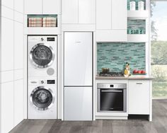 a modern kitchen with white cabinets and appliances