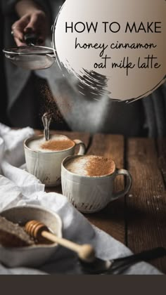 two mugs filled with cinnamon sitting on top of a table next to each other