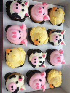 twelve cupcakes with pink and yellow frosting in the shape of farm animals