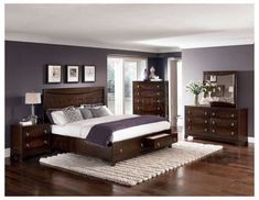 a bedroom scene with focus on the bed and dresser