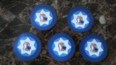 four blue frisbees sitting on top of a marble floor