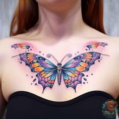 a woman's chest with a colorful butterfly tattoo on her upper half - arm