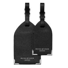 Set of 2 Luggage Tags in Black Saffiano from Aspinal of London Classic Leather Travel Accessories With Luggage Sleeve, Classic Leather Rectangular Travel Accessories, Modern Leather Travel Accessories With Leather Trim, Classic Black Travel Accessories, Elegant Black Leather Travel Accessories, Luxury Leather Luggage Tag With Sleeve, Luxury Leather Rectangular Travel Accessories, Classic Leather Luggage Tag, Classic Rectangular Travel Accessories For Business