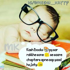 a baby wearing glasses laying on top of books