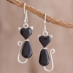 Carrying a loving vibe, two cute cats are crafted of black Guatemalan jade with sterling silver. Ruben and Gilda Perez design this fantastic pair of dangle earrings, drawing inspiration from their favorite animal. Earrings Drawing, Two Cute Cats, Love In Black, Black Jade, Coin Pendant Necklace, Cat Jewelry, Cat Earrings, Unique Gemstones, Shell Pendant