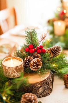 a table topped with pine cones and candles