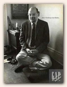 black and white photograph of a man sitting on the floor