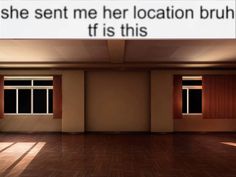 an empty room with two windows and a sign that says she sent me her location bruh, if it is this