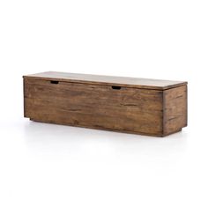 a wooden box sitting on top of a white floor