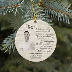 a personalized ornament hanging from a christmas tree with a photo on it