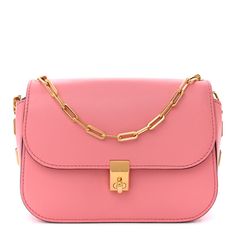 This is an authentic VALENTINO GARAVANI Vitello Chain Crossbody Bag in Pink.  This luxurious shoulder bag is crafted of smooth calfskin leather in pink. The bag features a gold chain shoulder strap with a facing crossover flap, and a squared gold turn lock.  The flap opens to a pink leather interior with zipper and patch pockets. This is an excellent shoulder bag for everyday wear, from Valentino! Luxury Everyday Pink Shoulder Bag With Gold-tone Hardware, Pink Rectangular Shoulder Bag For Everyday Luxury, Pink Shoulder Bag With Metal Hardware For Evening, Pink Formal Bag With Metal Hardware, Elegant Pink Shoulder Bag With Metal Hardware, Elegant Pink Bags With Metal Hardware, Pink Flap Bag With Gold-tone Hardware, Luxury Pink Bag With Metal Hardware, Luxury Pink Bags With Metal Hardware