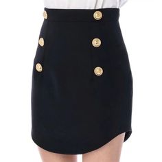 Our Lesia Mini Skirt with Gold Buttons is the perfect addition to any fashionista's wardrobe. It's made from high-quality materials. and it's soft. comfortable. and lightweight. The skirt features a mini length that is both flirty and fun and the gold buttons add a touch of glamour and sophistication. The skirt can be dressed up or down. making it perfect for a variety of occasions. from a casual day out to a night on the town.Pair it with a pastel cropped top and nude heels if you are choosing Office Skirts, Minimalism Style, Mini Office, Office Skirt, Black Strappy Heels, Instagram And Snapchat, Nude Heels, Gold Buttons, Cropped Top