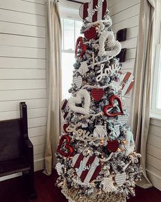 a decorated christmas tree in the corner of a room