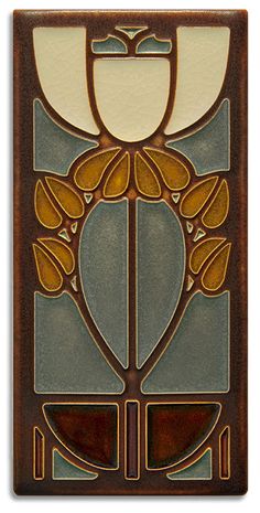 an art deco tile with flowers and leaves on it