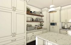 a kitchen with white cabinets and marble counter tops