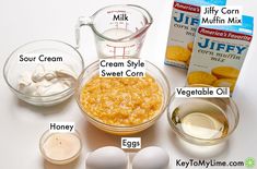 ingredients to make an egg muffin recipe laid out on a white counter top, including eggs, yogurt and cream