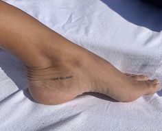 a person with a small tattoo on their foot