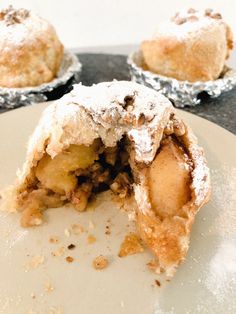 an apple pie is cut in half on a plate