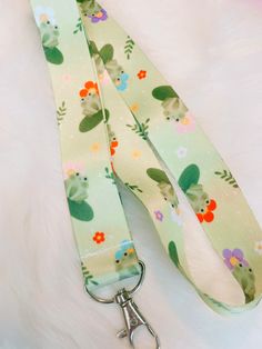 Upgrade your work accessories with this trendy and adorable lanyard! Get yours today and experience the joy of wearing a lanyard that truly reflects your personality. The durable fabric ensures that your ID cards, badges, and keys are held securely, eliminating the risk of misplacement. ---------------------------------------- 🧡 SIZES & MATERIALS 🧡  🐸 Size: Approximately 17in long on each side and 1in wide  🐸 MetalClasp  🐸 Double-sided print  🧡 I design all lanyards with love and care🧡  - Cute Adjustable Lanyards For Gifts, Cute Adjustable Lanyard As Gift, Adjustable Green Lanyards As Gifts, Lanyard Id Holder, Badge Lanyard, Work Accessories, Badge Holder, Id Holder, Badge Holders Lanyard