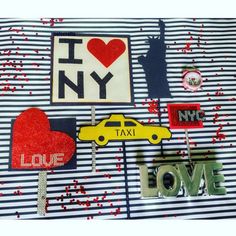 a table topped with magnets covered in different types of stickers and paper hearts