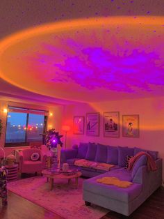 a living room filled with furniture and purple lighting