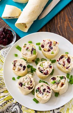 small appetizers are arranged on a white plate