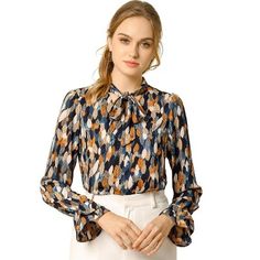 This floral top has a retro floral print for an easy-to-style look, and the soft chiffon fabric lends a comfortable, soft feel. Style it with your favorite jeans or skirts for a casual and chic look. Whether you're in the office or out on the town, this floral print blouse is perfect for any occasion. You will look fierce yet feminine in this lightweight woven blouse with a burgundy, black, and yellow floral print. The model is wearing an X-Small. Ruffle Collar Shirt, Blouse Chiffon, Trumpet Sleeve, Women's Tie, Tent Dress, Satin Blouses, Chiffon Ruffle, Floral Print Blouses, Floral Print Tops