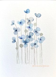 watercolor painting of blue flowers on white paper