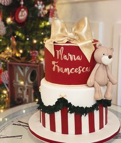 there is a red and white cake with a teddy bear on the top that says mama franceso