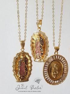 THIS ITEM SHIPS SAME OR NEXT-DAY 📦✈ Oval pendant with a depiction of Our Lady of Guadalupe The figure of the Virgin Mary wears a mantle encrusted with crimson and black crystals and scalloped edge clear crystal frame Pendant measures 40mm (1.6 inches), strung on 18" adjustable link chain Lobster clasp closure 18K gold-plate over alloy metal Clear and colored zircon diamonds Suitable as a gift for First Communion, baptism, or just because Gloria Virgin Mary Necklace + Clear Baguettes also shown Crystal Frame, Mary Necklace, Virgin Mary Necklace, Cross Earrings Studs, Our Lady Of Guadalupe, Crystal Cross, Lady Of Guadalupe, Hand Of Fatima, Custom Name Necklace