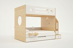 a wooden bunk bed with drawers and a built - in shelf for the top mattress