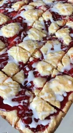 a pie with white toppings on it sitting on a table