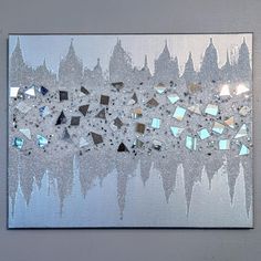 a piece of art that looks like it is made out of silver foil and mirrors