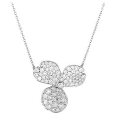 This delicate Tiffany & Co. pendant features a three-petal paper flower motif, crafted in platinum for a luxurious and timeless look. Sparkling diamonds adorn the petals, adding a touch of brilliance and elegance. The pendant's intricate design and high-quality materials make it a truly special piece. There are a mix of round and rose cut diamonds that weigh approximately 0.85 total carat; they are F-G color and VS clarity. Stamped: "Tiffany & Co. PT950" Luxury Delicate Chain Flower Pendant Jewelry, Diamond Pendant Tiffany & Co., Chain Diamond, Flower Motif, Drop Necklace, Rose Cut Diamond, Sparkle Diamonds, Tiffany & Co., Rose Cut