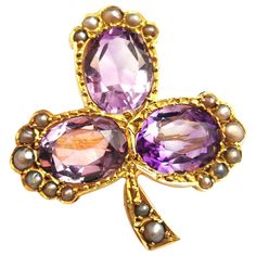 An impeccable antique Amethyst and pearl Shamrock brooch. Rich 15kt gold gives a warm glow to this piece and the brooch has been designed as a three leaf shamrock or clover leaf. Each leaf is set with the most beautiful rich purple Amethyst, oval faceted cut with an approx total carat weight of 3.60ct, estimated in setting. The stem and the ends of each leaf are set with creamy seed pearl. It has an old C type clasp and pin fastener. A well made brooch with lots of fine detailing. This brooch ca Purple Items, Vintage Lavender, Rich Purple, Vintage Things, Seed Pearl, Contemporary Jewelry, Long Chain, Clover Leaf, Jewelry Lover