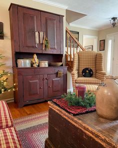 a living room filled with furniture next to a christmas tree