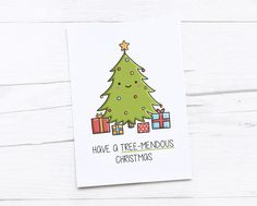 a card with a christmas tree on it and presents under the tree that reads, have a tree - mendouous christmas