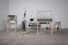 an assortment of electronic equipment sitting on top of each other in front of a white wall